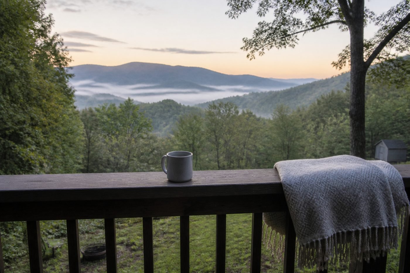 Wooden porch overlooking Blue Ridge mountains in morning fog